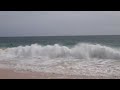 Massive waves sandy beach Oahu Hawaii