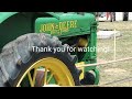 Old Stationary John Deere baler at work.