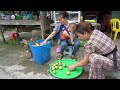 Single mother with children to harvest passion fruit to sell at the market-lytieuly