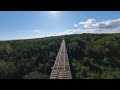 Flying FPV drone through abandoned trestle bridge
