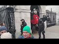 Tourist slaps horse across the  face 3 times guard shouts step back gets police #horseguardsparade