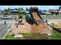 Clearing weed and burying drainage system in front of the house next to the motorway.