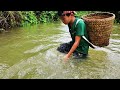 Orphan Boy.  Trap Fish Using Tree Pipe When It Rains Heavy, Lots of Fish