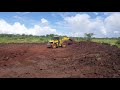 Using a loader to make a water pan.