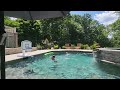Maddox jumping into pool and shooting a hoop