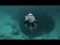 Guillaume Nery base jumping at Dean's Blue Hole, filmed on breath hold by Julie Gautier