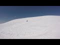 snowboarding behind snowmobile