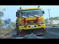 The equipment and activity process of a road construction project at a road in a rural area.