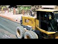 Awesome technology of a yellow SDLG motor grader on a road construction site is a heavy-duty machine