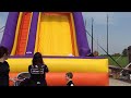 Two brothers come together down a. Slide at MOD