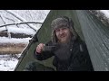 caught in a snowstorm, save lives in a bushcraft shelter
