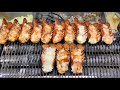 Melted Cheese over Roasted Lobsters. Korea Street Food in Myeongdong, Seoul