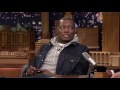 Michael Che Finally Pays Back the $1,000 Tommy Hilfiger Loaned Him